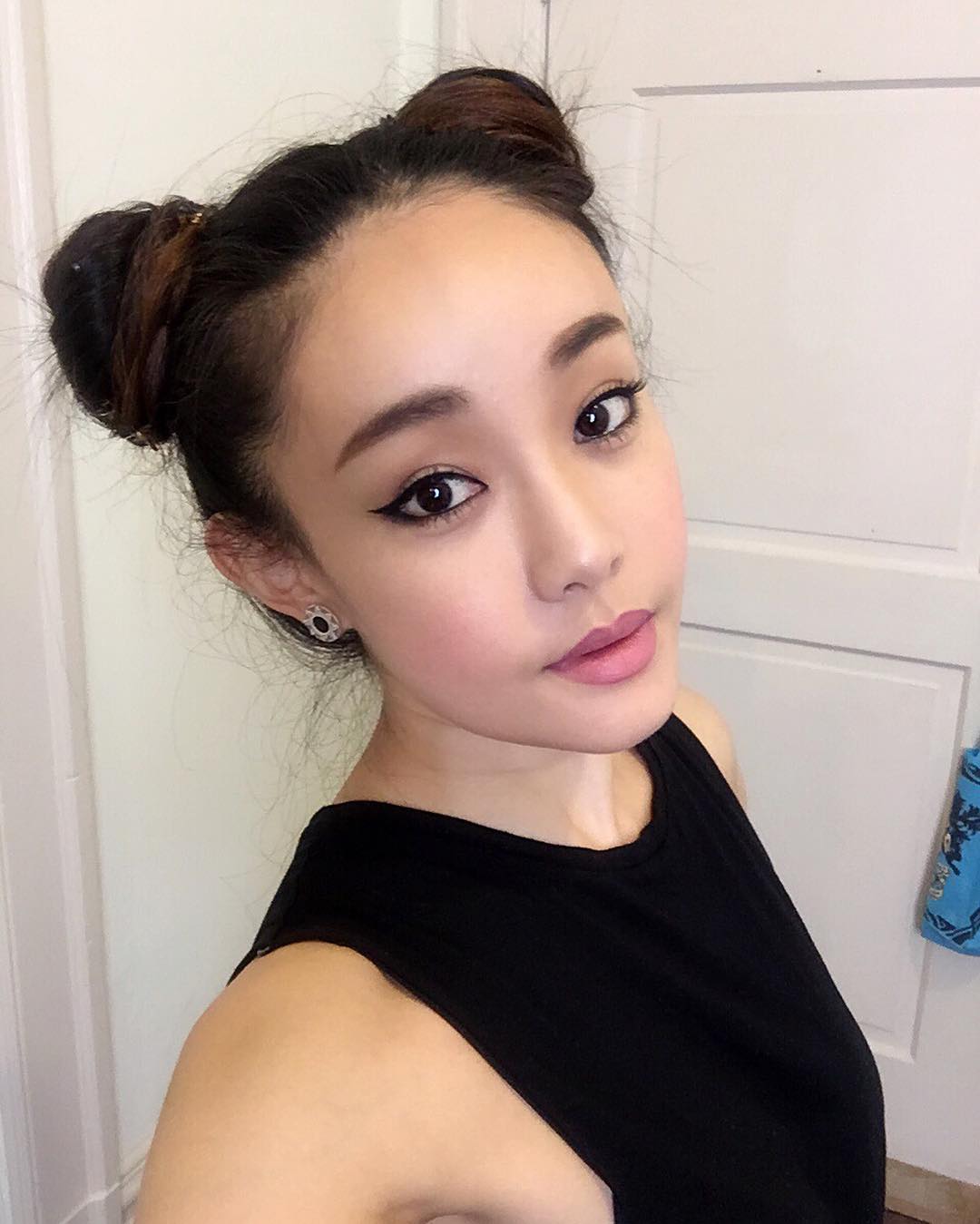 Playful Space Buns With Dark Brunette Hair