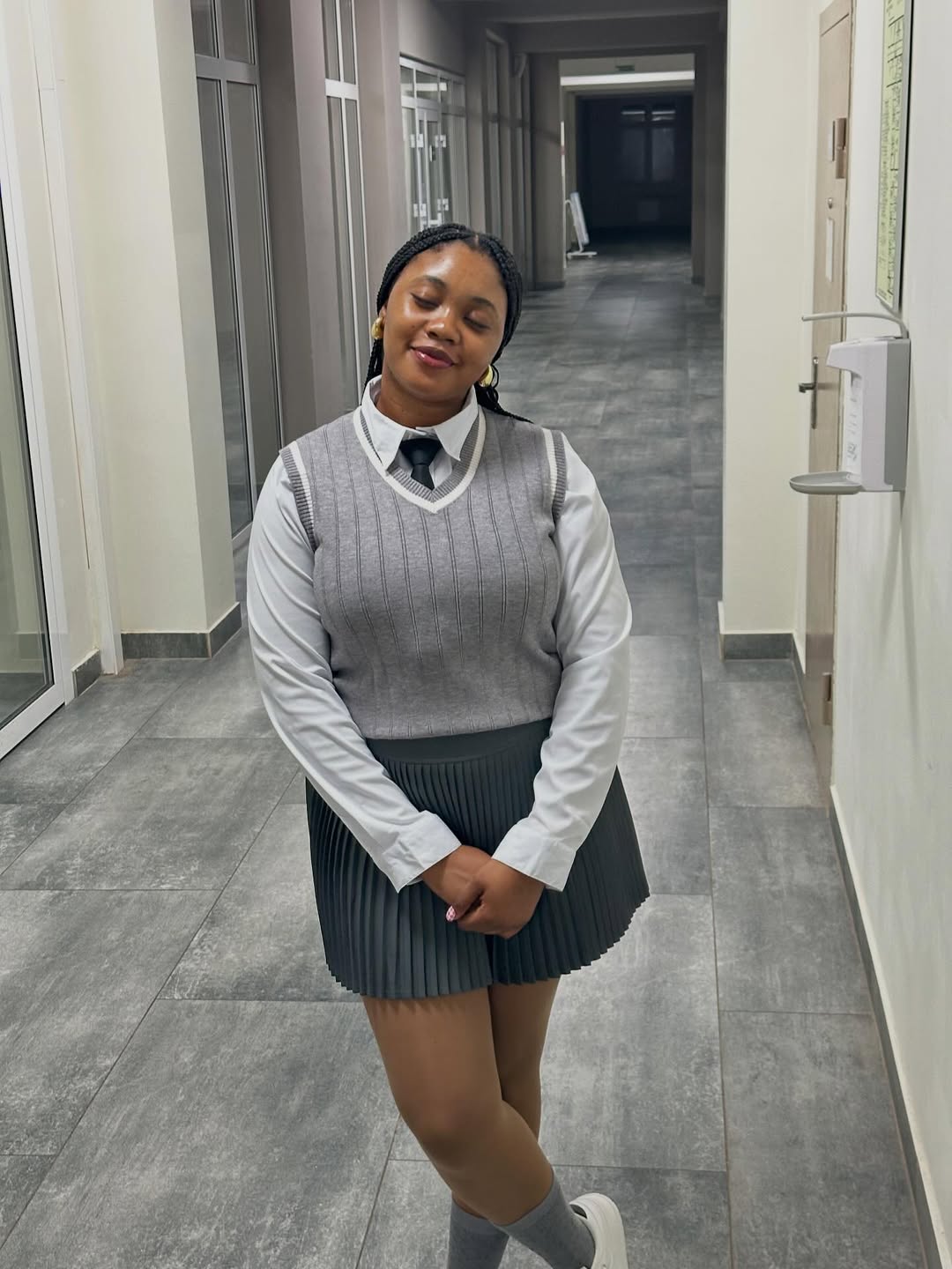 Preppy Pleated Skirt And Sweater Vest Look