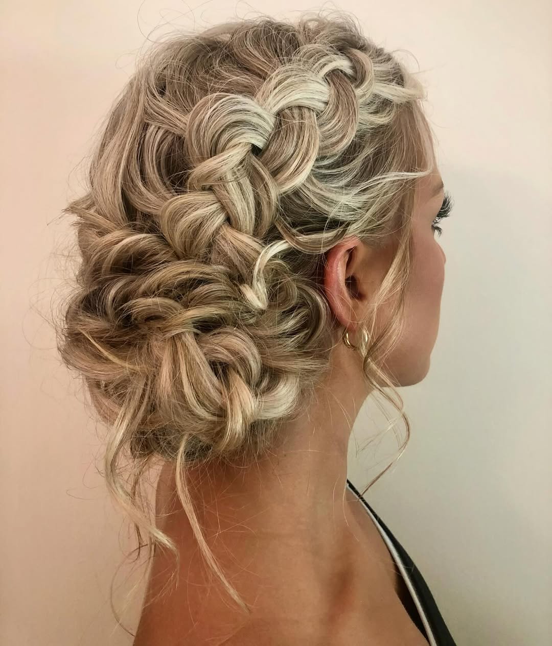 Relaxed Braided Updo With Face Framing Tendrils