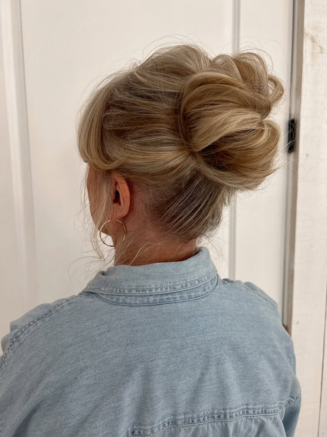 Relaxed Loose Blonde High Bun Style