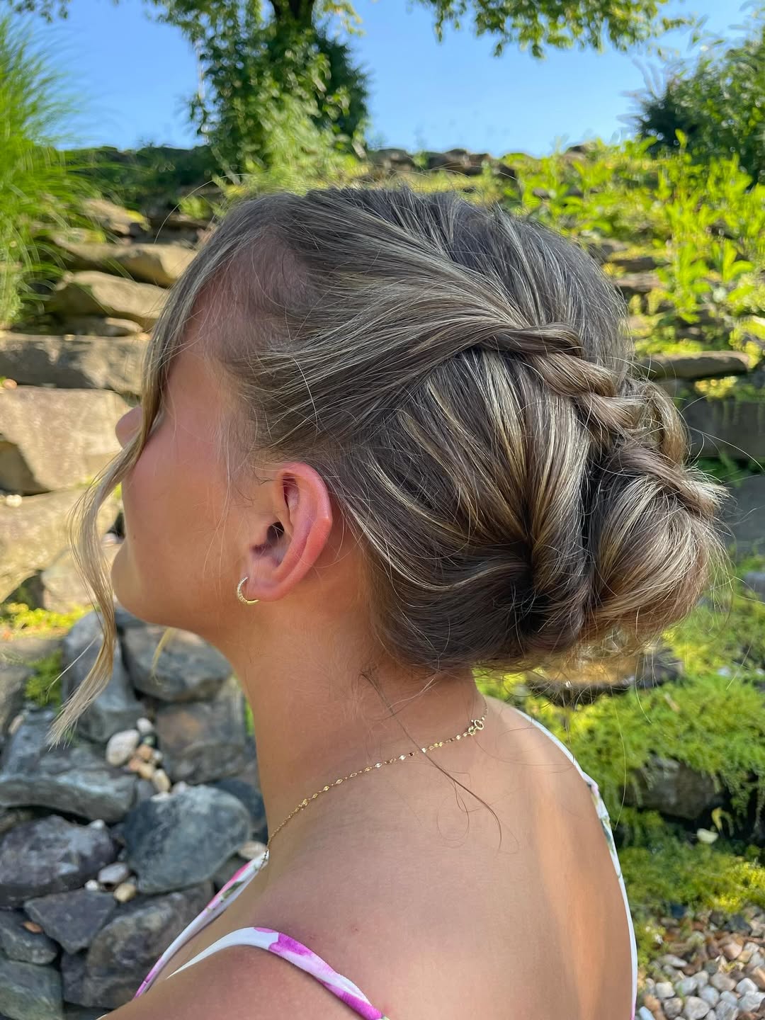Relaxed Twisted Low Bun With Face-Framing Strands