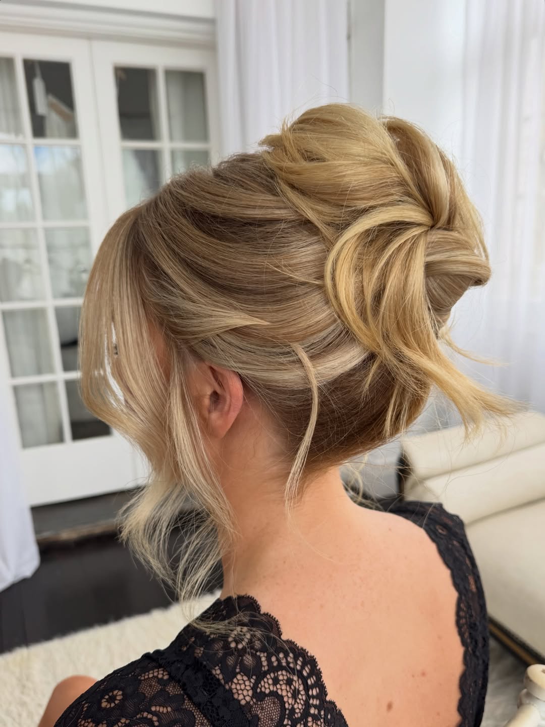 Relaxed Updo With Face-Framing Honey Blonde Strands