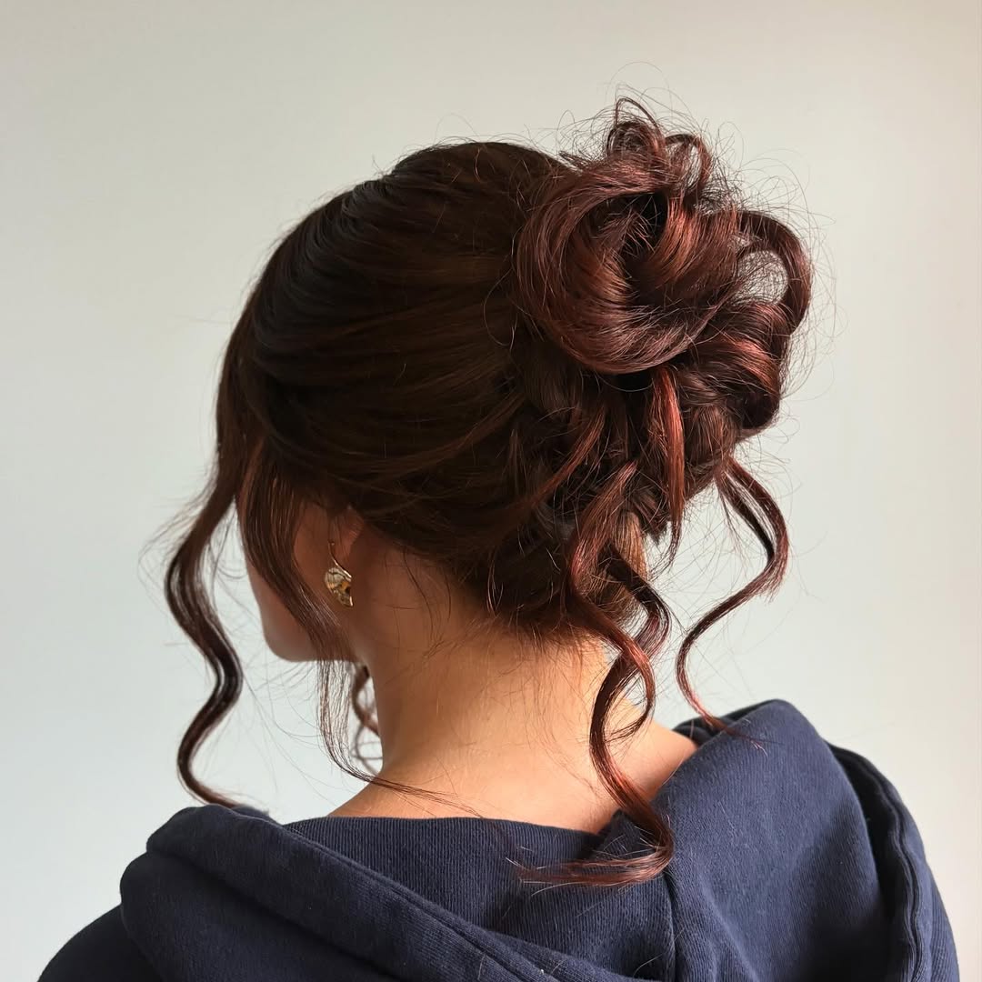 Romantic Messy Updo With Face Framing Tendrils