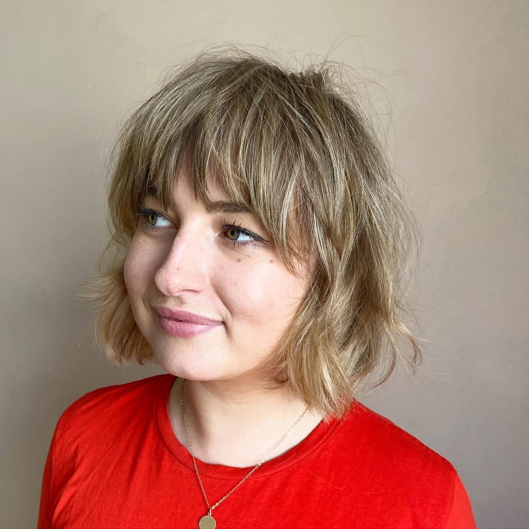 Shaggy Bob With Textured Bangs And Blonde Highlights