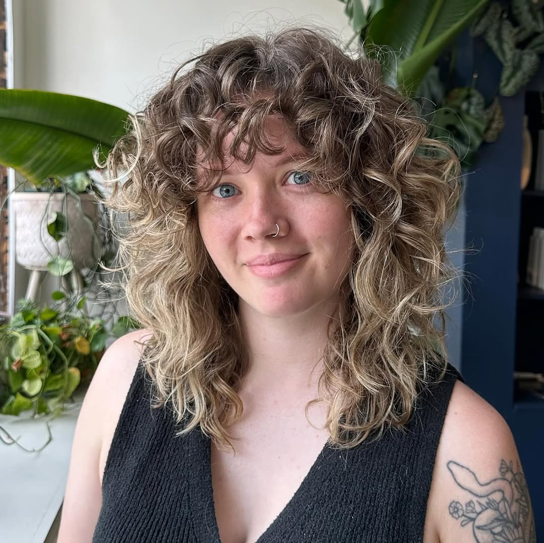 Shaggy Brunette Curly Cut With Wispy Bangs