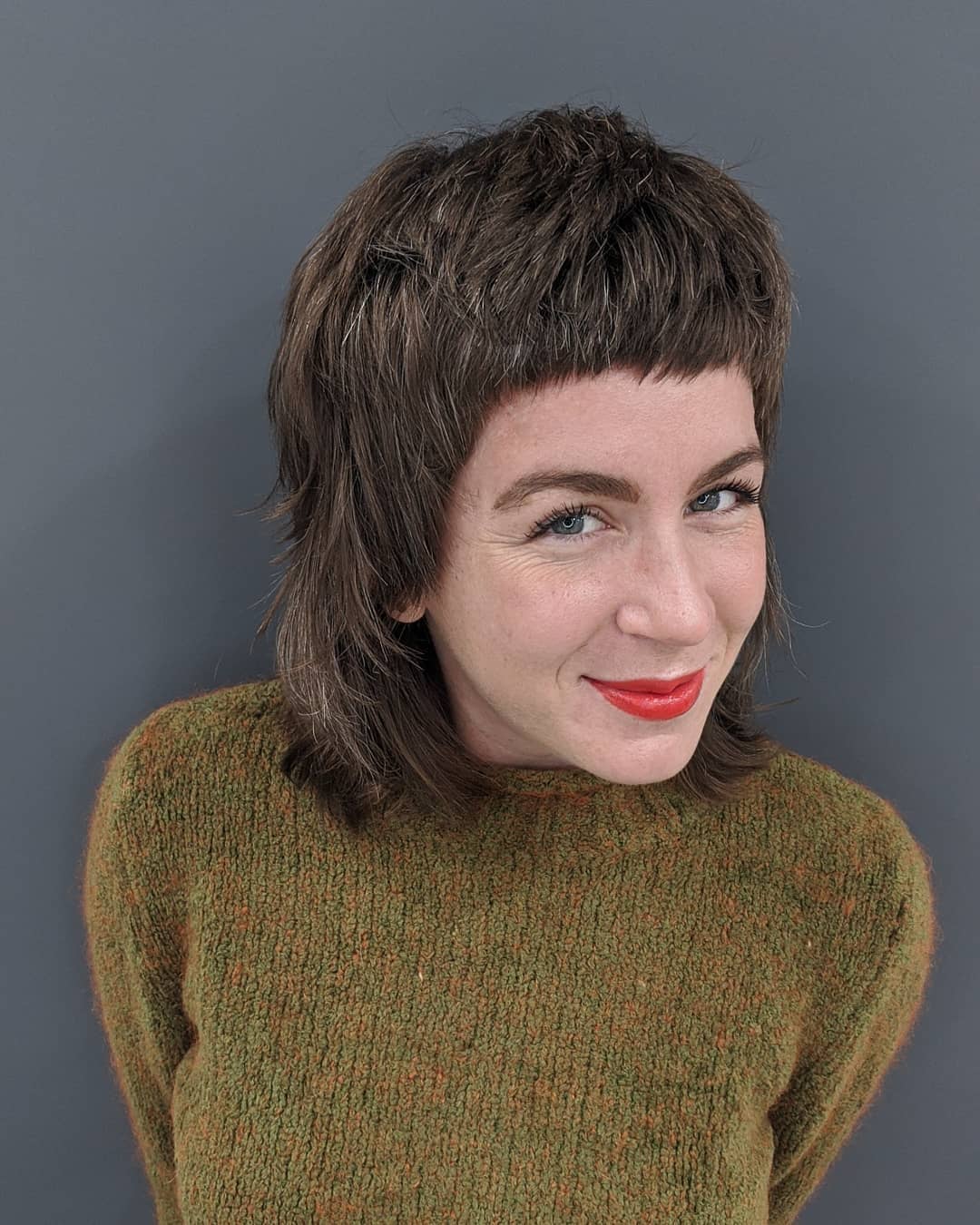 Shaggy Brunette Mullet with Micro Bangs
