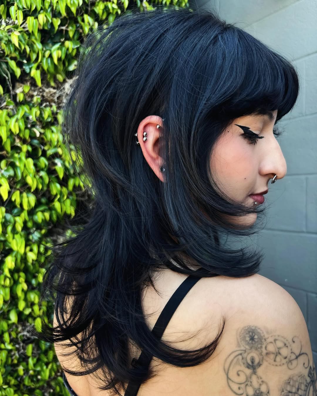 Shaggy Jet Black Layers With Blunt Bangs