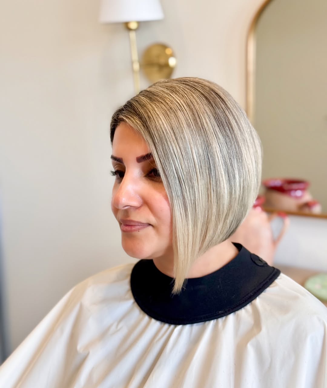 Sleek Angled Platinum Bob With Shadow Root