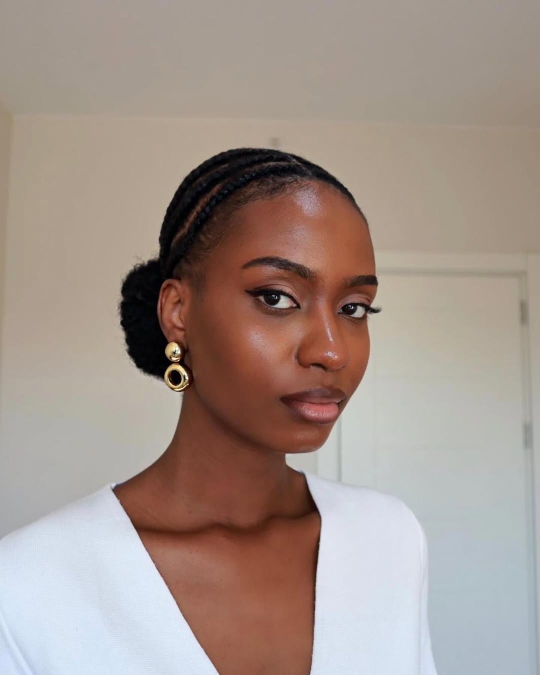 Sleek Cornrow Braids Into Low Bun