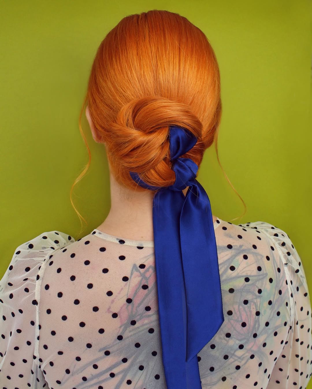 Sleek Ginger Low Bun With Cobalt Ribbon