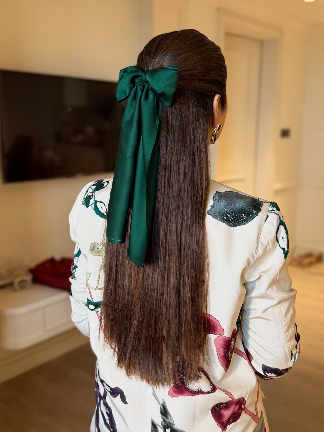 Sleek Half-Up Hairstyle With Emerald Green Bow