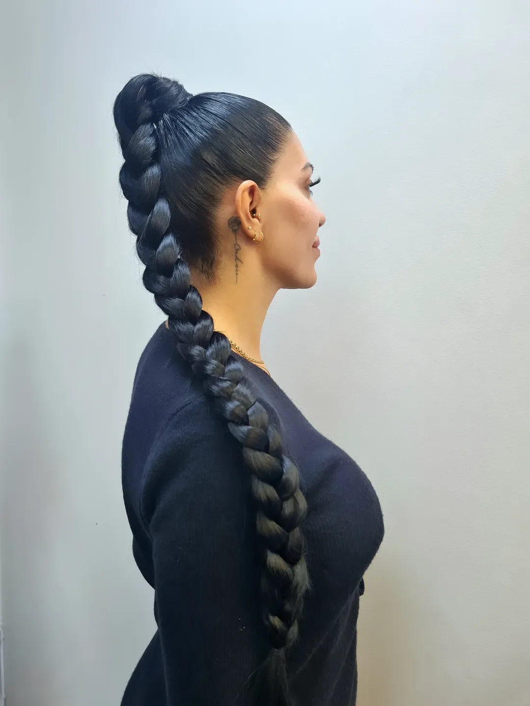 Sleek High Bun With Dramatic Fishtail Braid