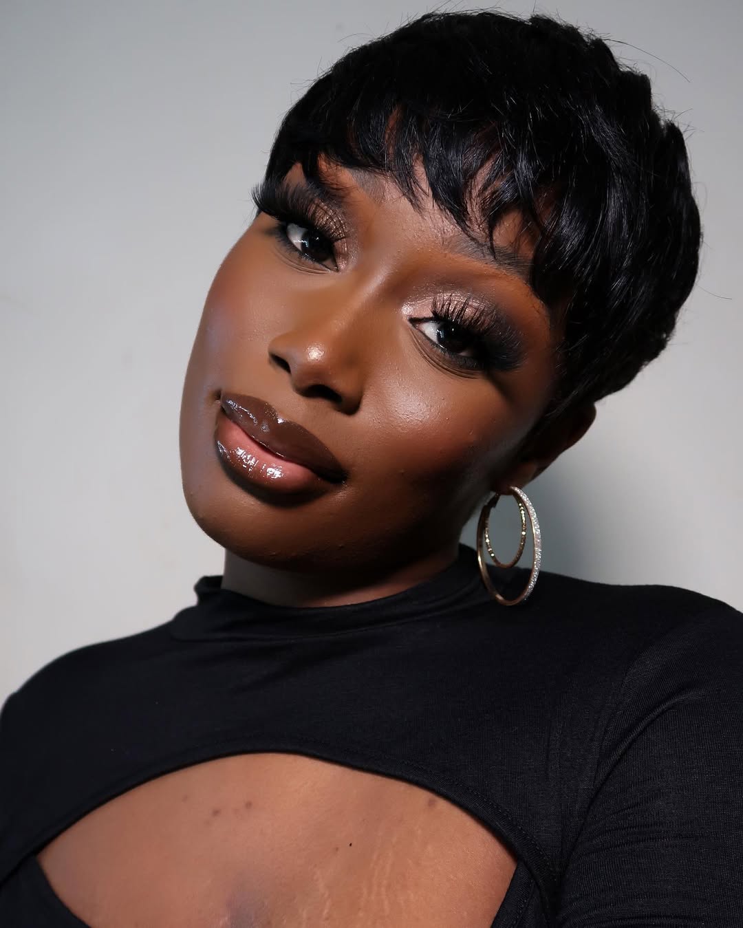 Sleek Wavy Pixie With Full Fringe