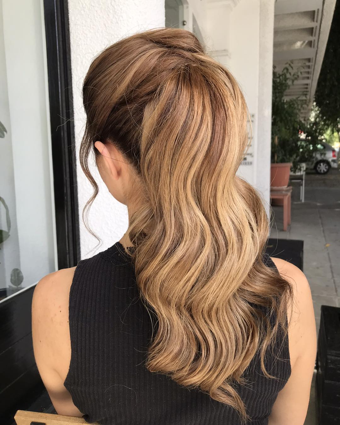 Soft Waves High Ponytail With Face-Framing Tendrils