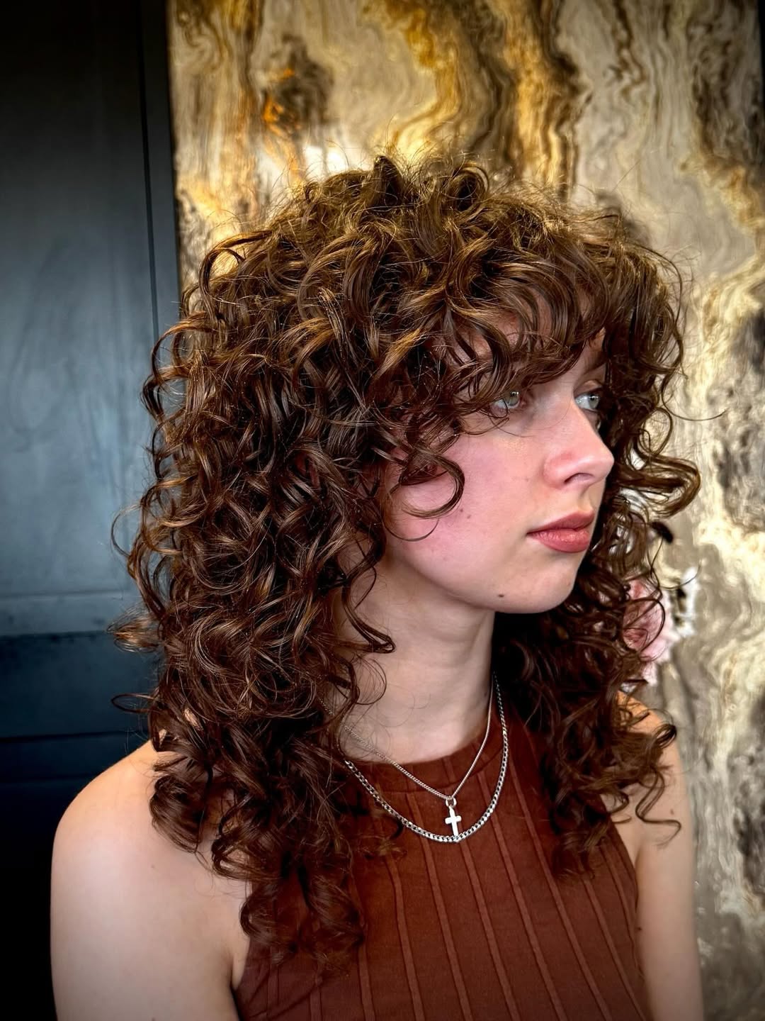 Textured Auburn Shag With Curly Bangs
