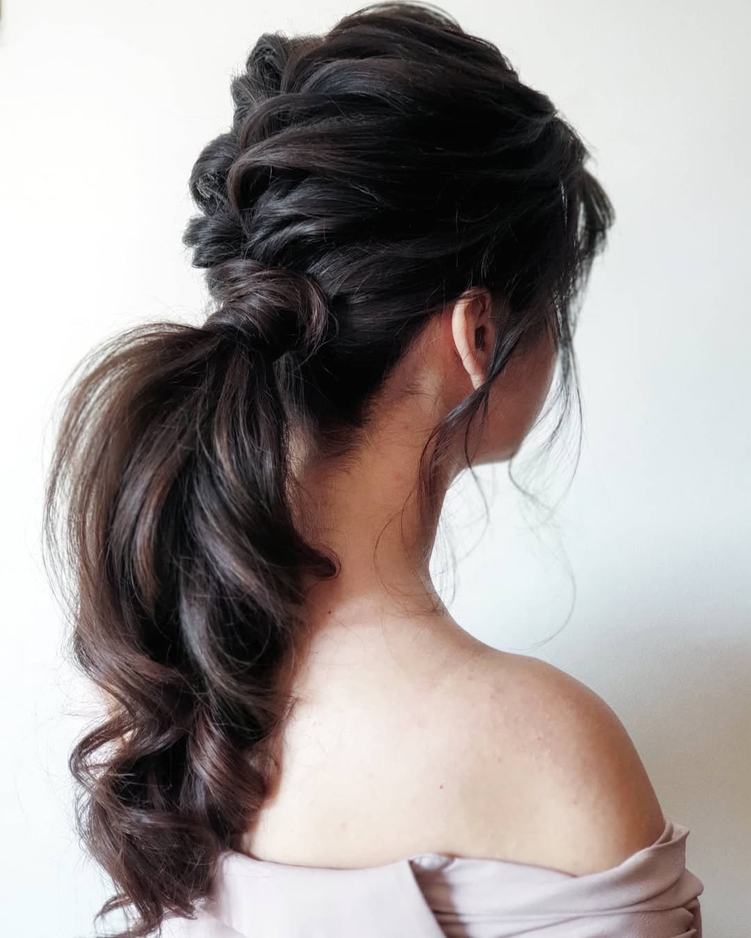 Textured Braided Ponytail With Voluminous Waves