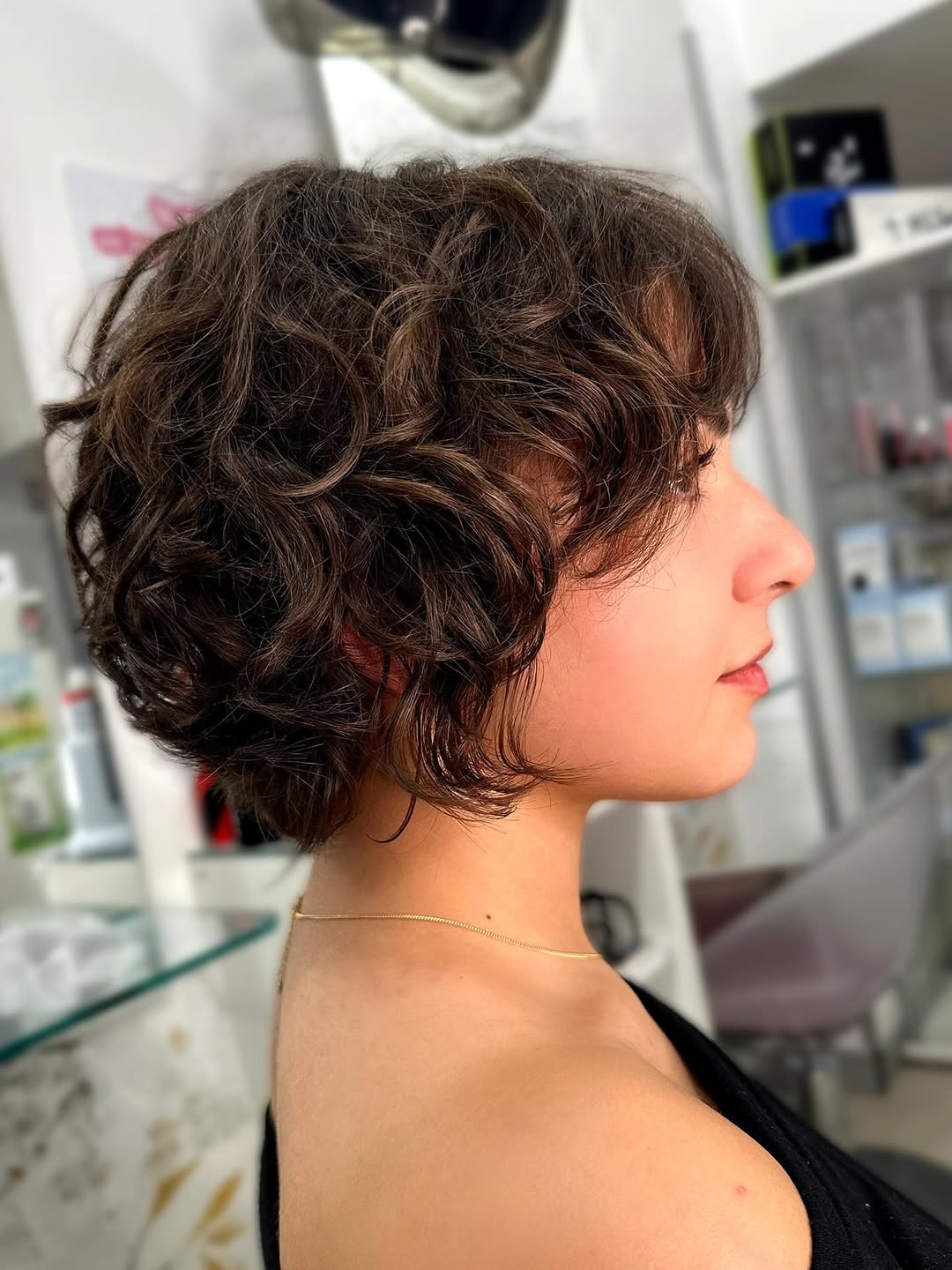 Textured Brunette Curly Pixie With Wispy Bangs