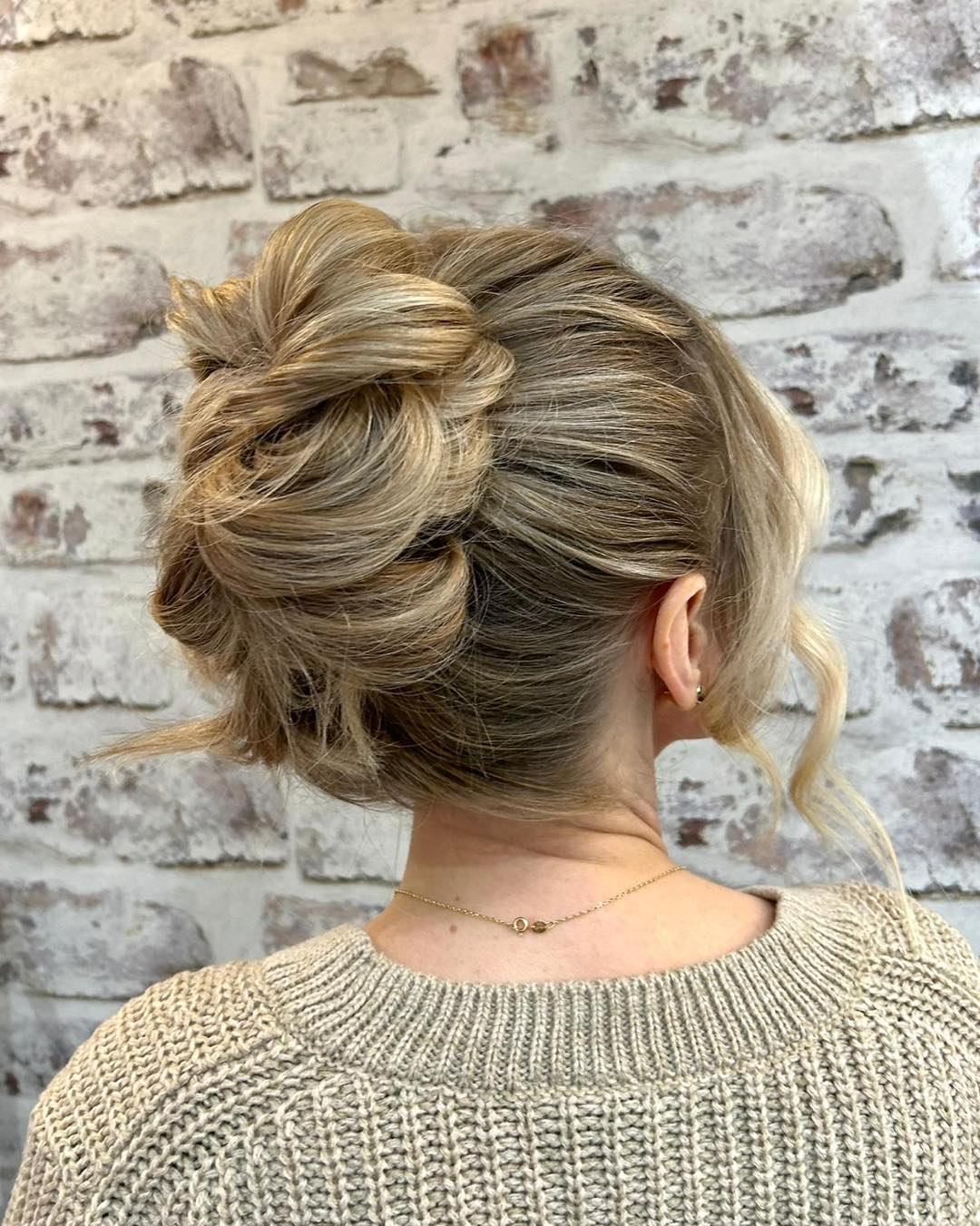 Textured French Twist Updo With Loose Tendrils