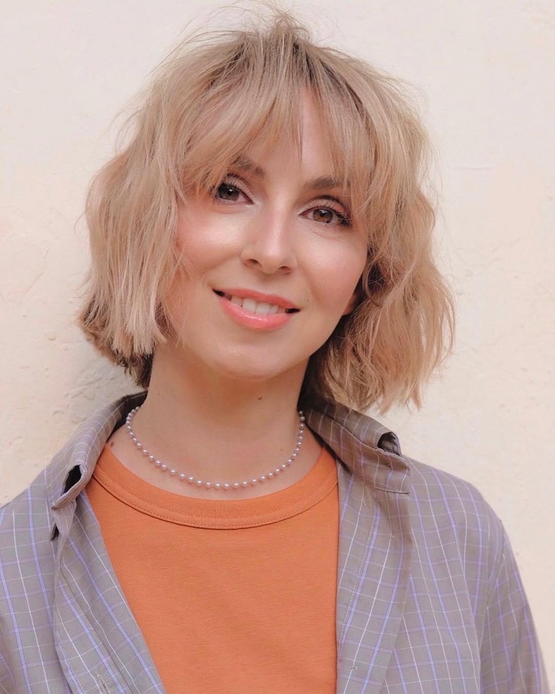 Textured Platinum Blonde Bob With Wispy Bangs