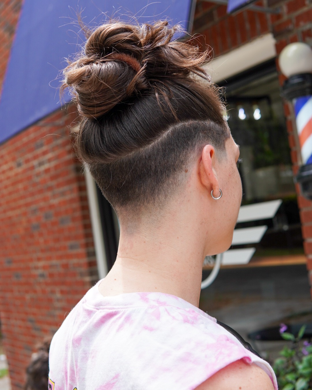 Undercut With Messy Top Knot And Fade