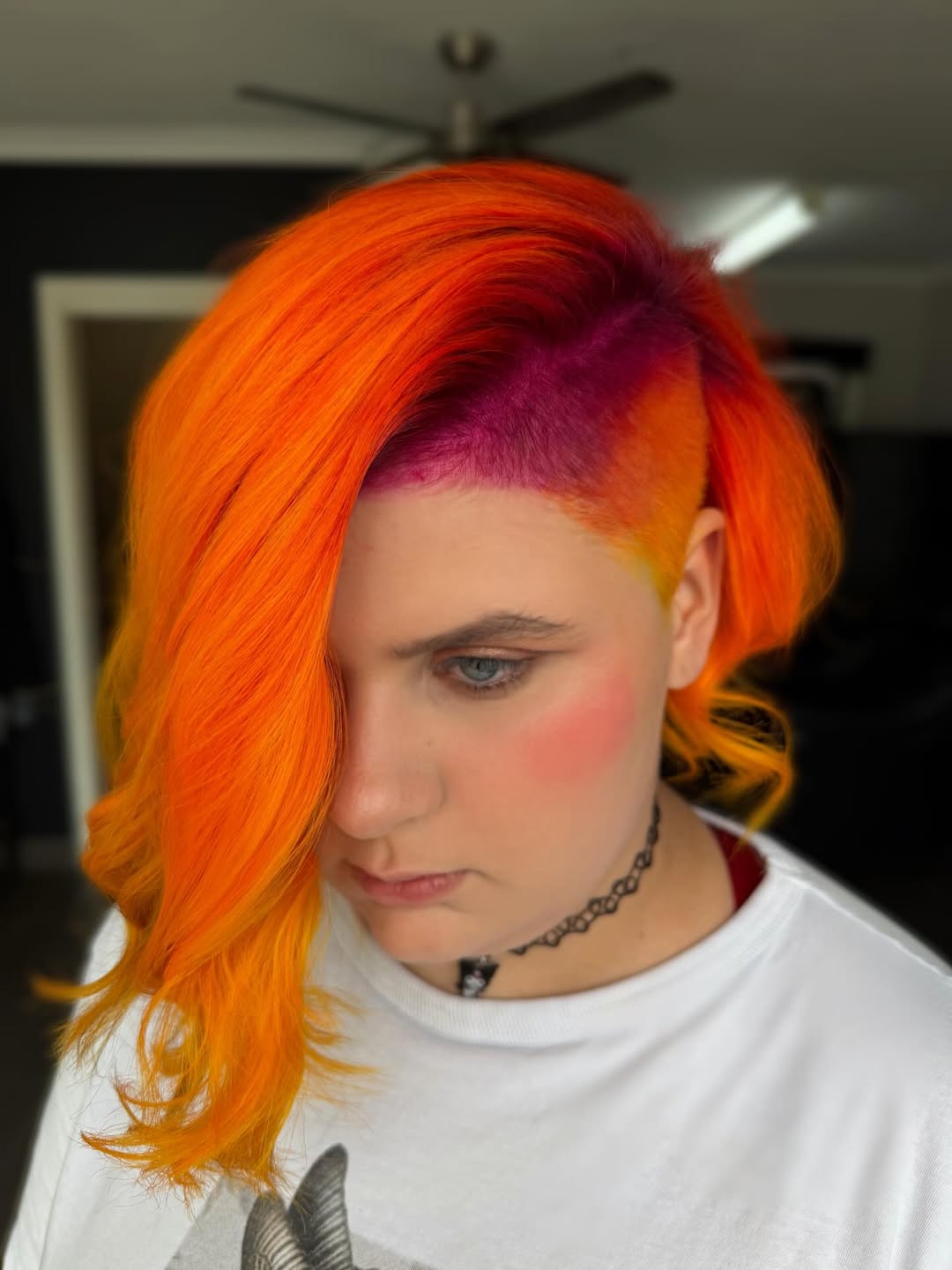 Vibrant Fiery Orange Undercut With Magenta Roots