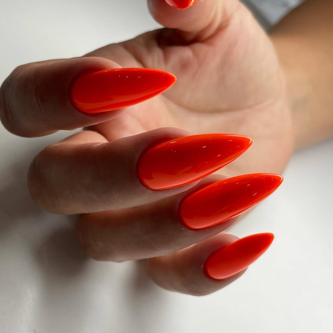 Vibrant Glossy Orange Stiletto Nails
