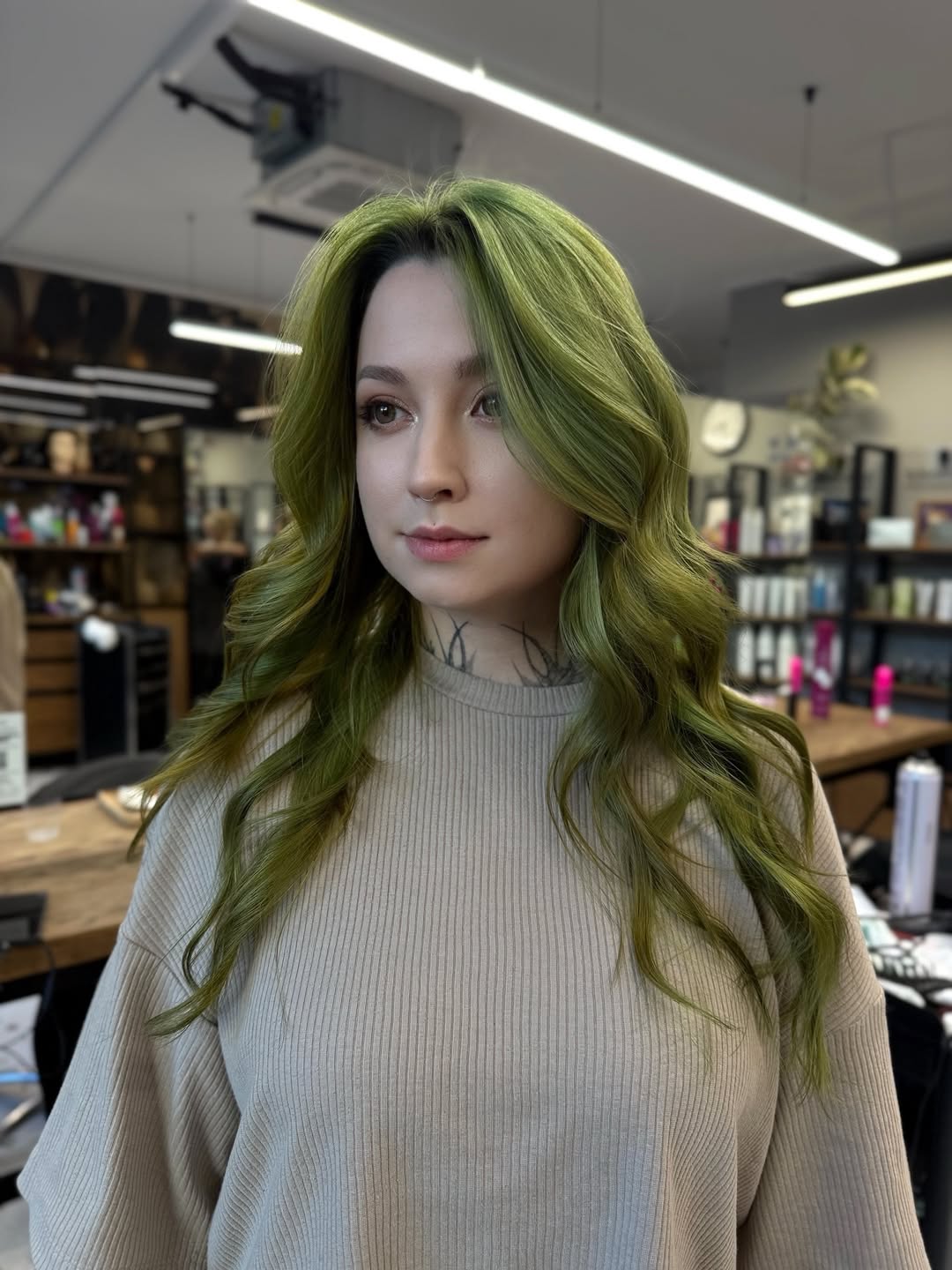 Vibrant Green Hair With Wavy Shoulder-Length Layers