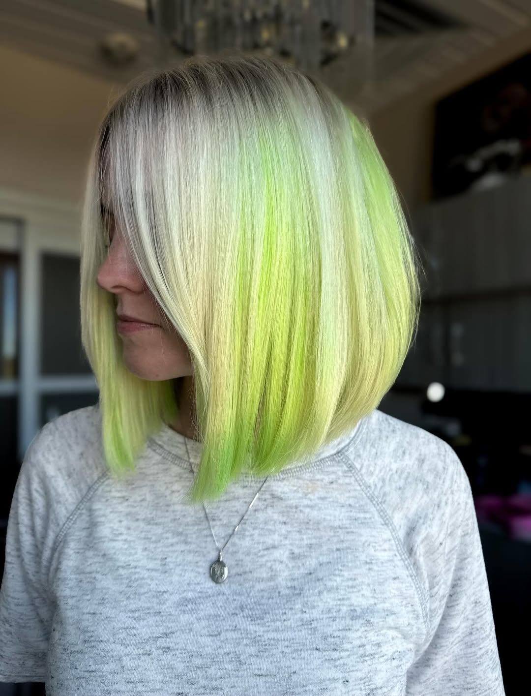 Vibrant Neon Green On Asymmetrical Platinum Bob