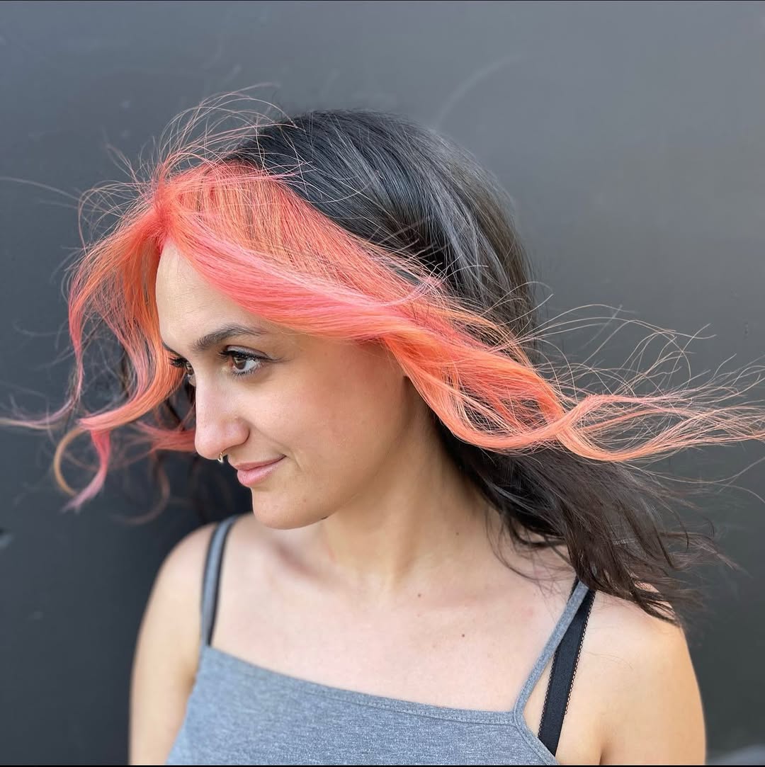 Vibrant Neon Peach Face Frame With Dark Hair