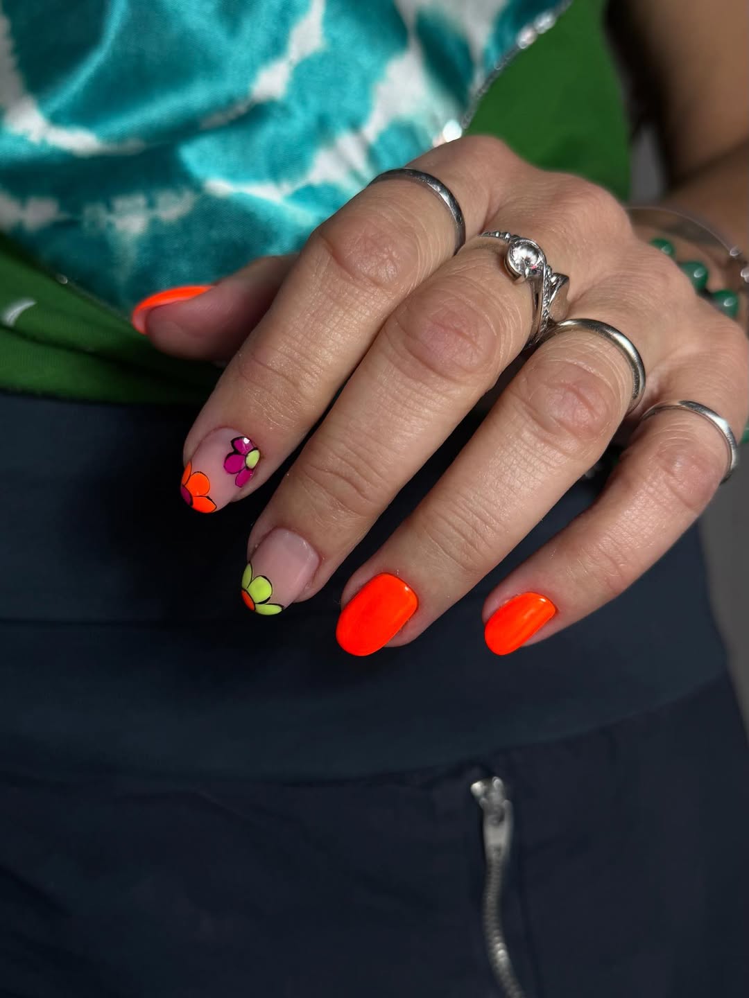 Vibrant Orange And Floral Accent Short Oval Nails