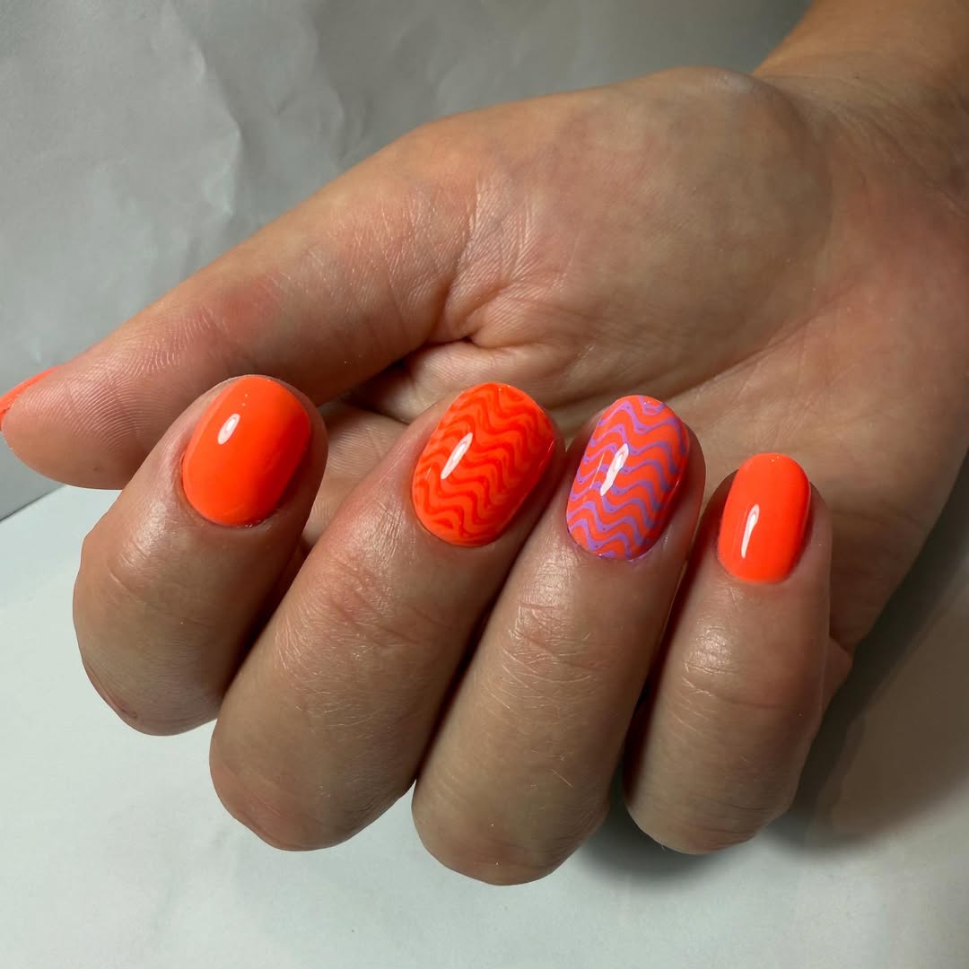 Vibrant Orange and Purple Wavy Groovy Short Oval Nails