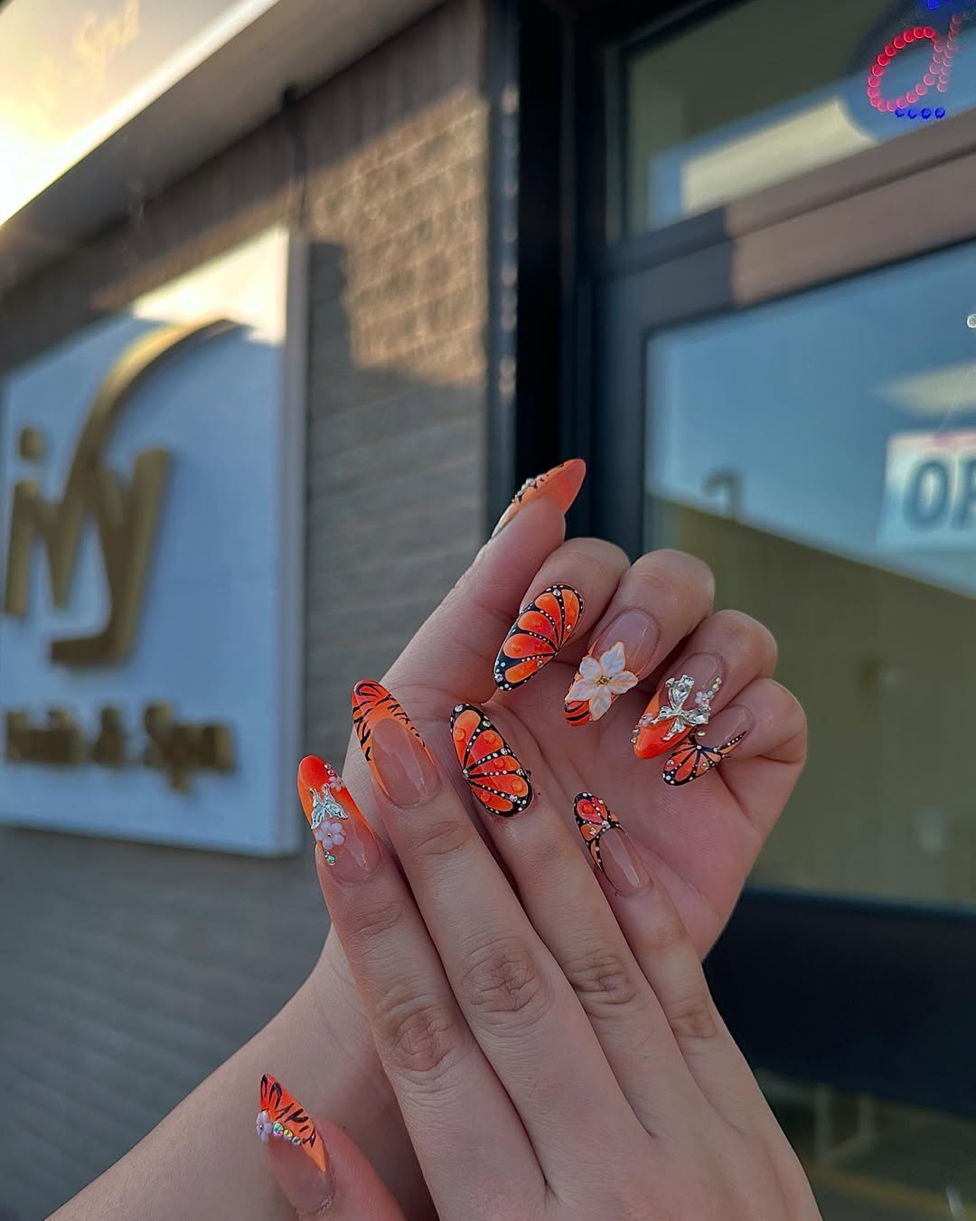Vibrant Orange Butterfly Almond Accent Nails