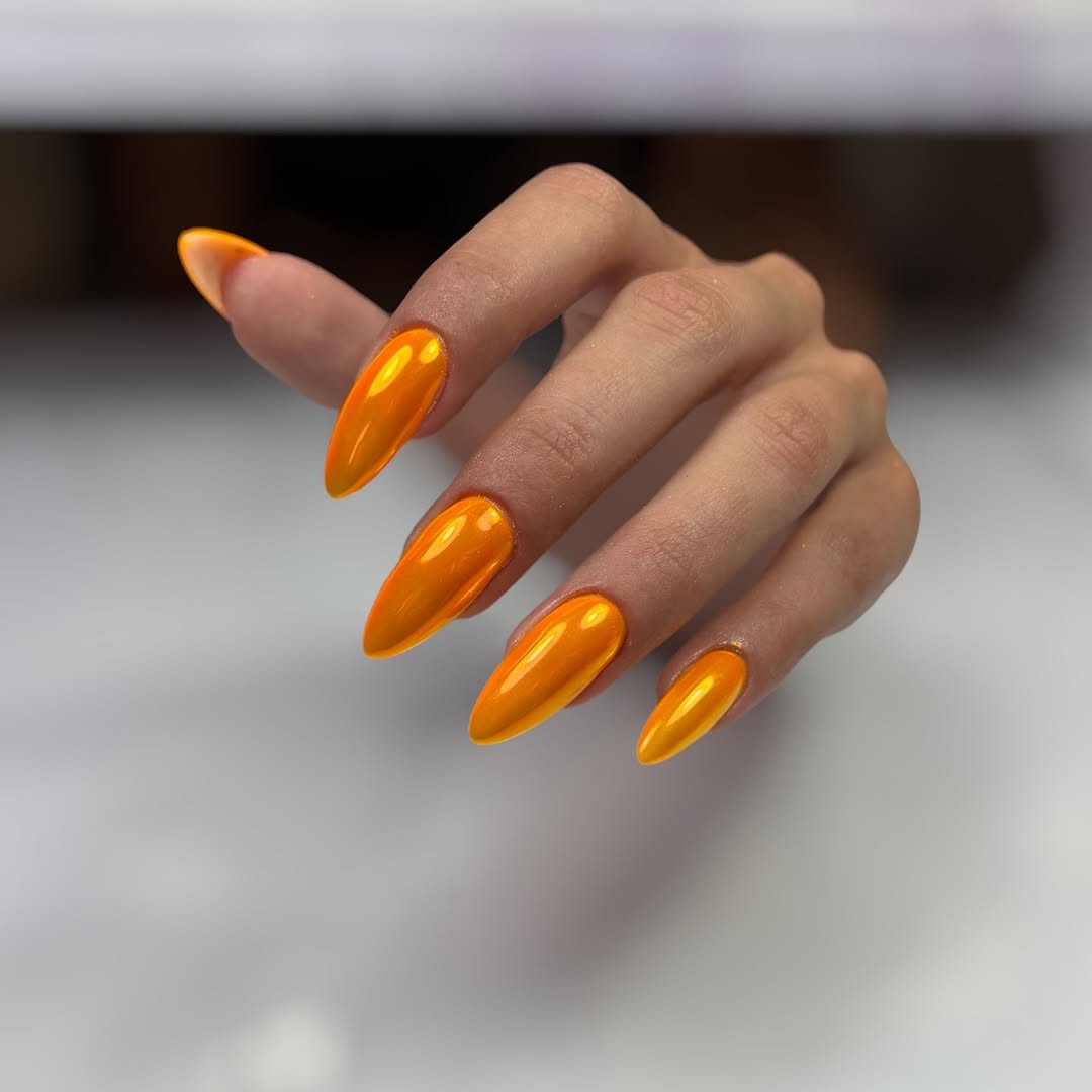 Vibrant Orange Chrome Stiletto Nails