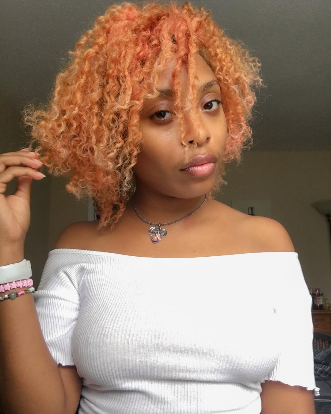 Vibrant Peach Curls With Natural Roots
