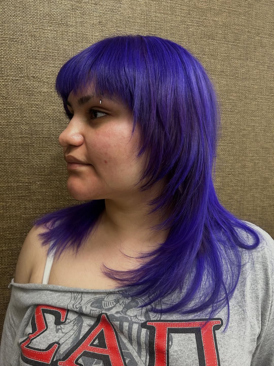 Vibrant Purple Layered Mullet with Blunt Bangs