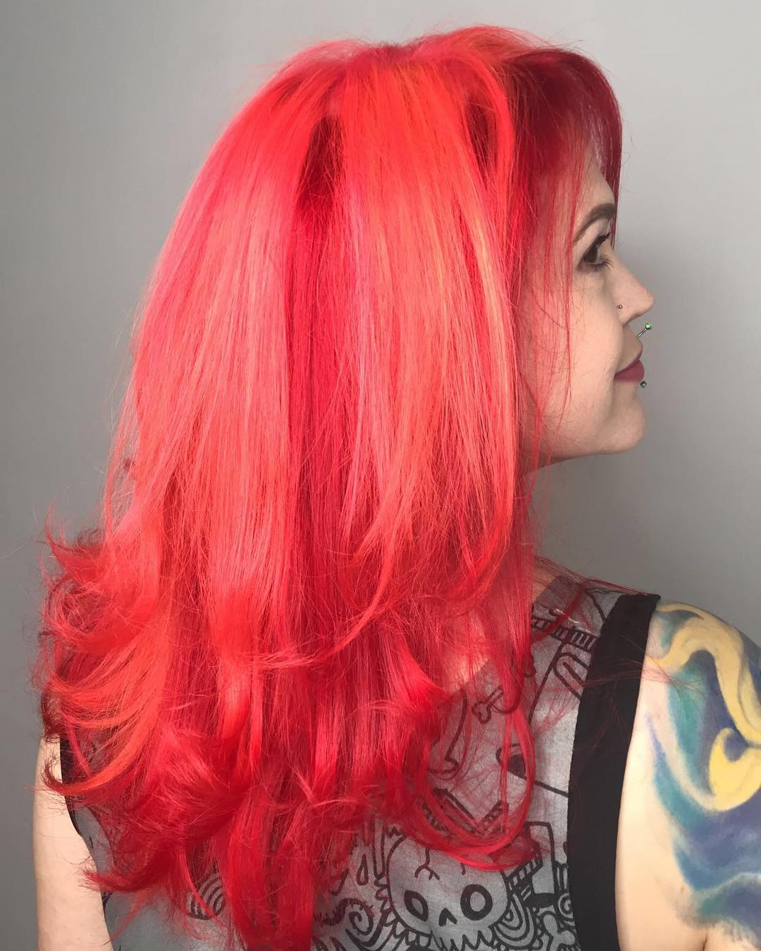Vibrant Red Layers With Face Framing Bangs
