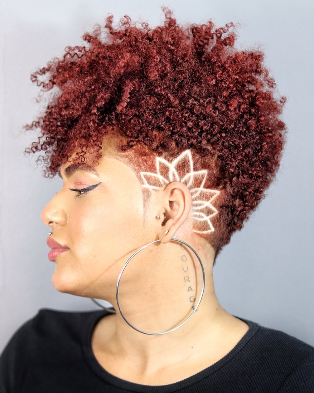 Vibrant Red Tapered Curly Cut With Hair Tattoo