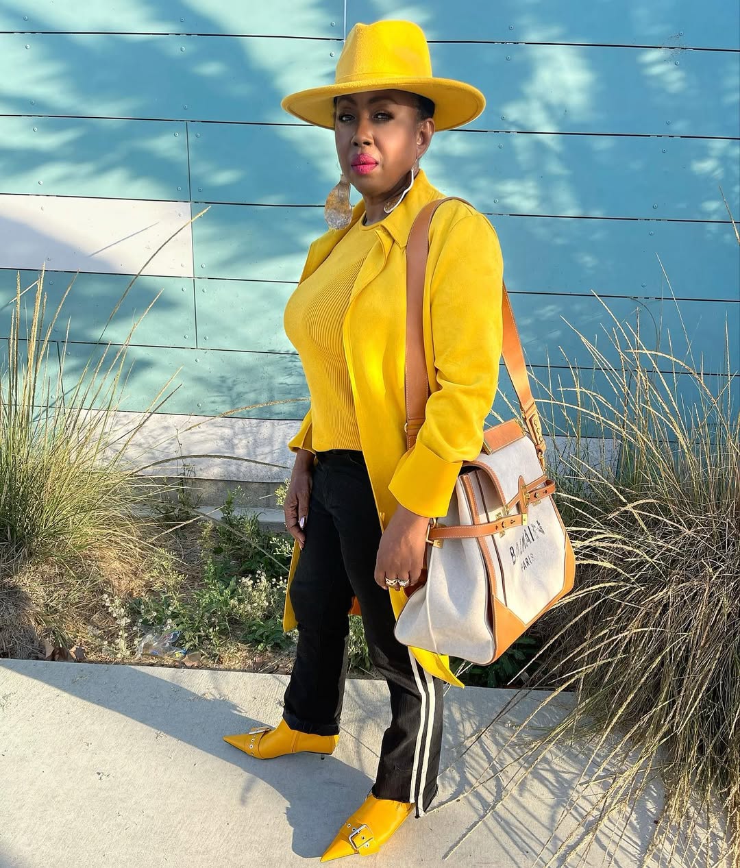 Vibrant Yellow Monochromatic Look with Black Accents