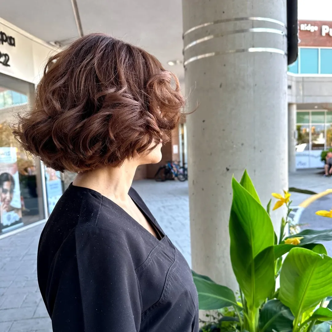 Voluminous Auburn Bob With Bouncy Curls