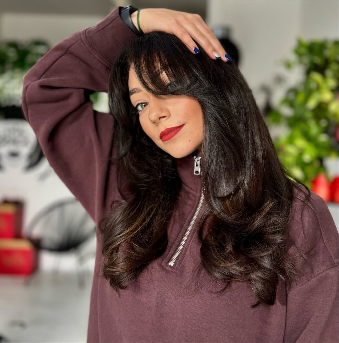 Voluminous Brunette Layers With Swooping Curtain Bangs
