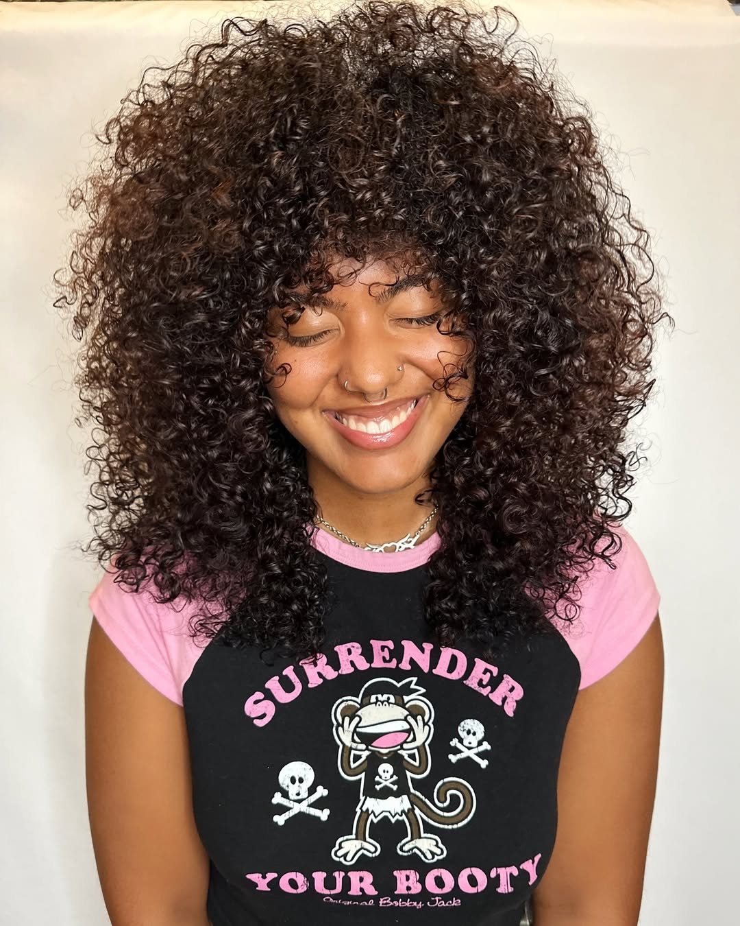 Voluminous Curly Shag With Full Fringe