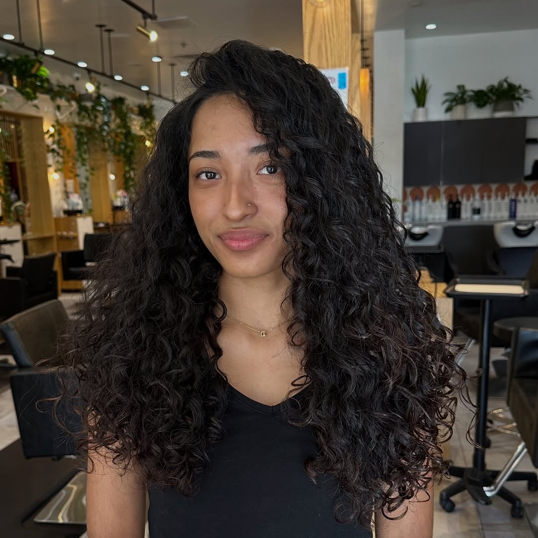 Voluminous Dark Brown Curly Hair With Layers