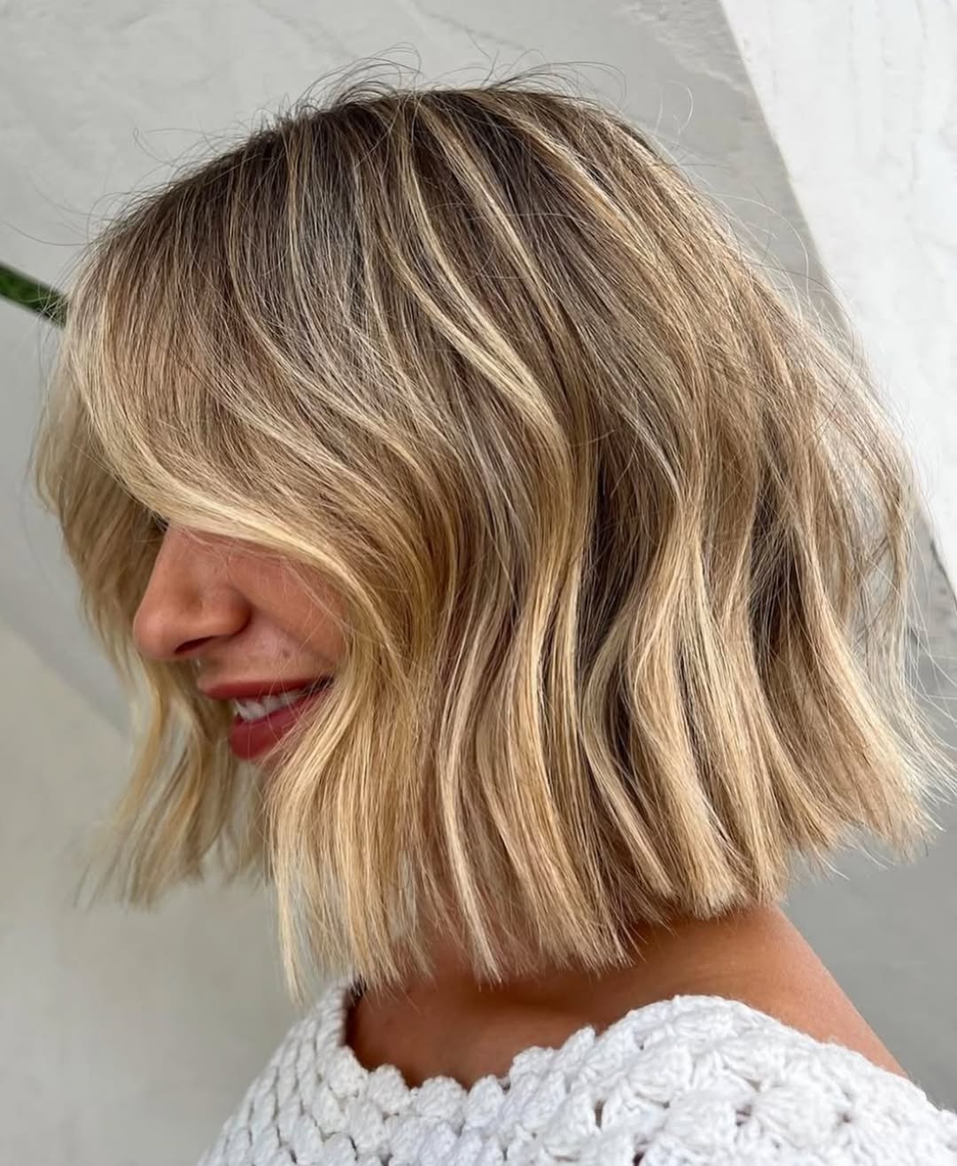 Wavy Chin Length Blonde Bob With Wispy Bangs