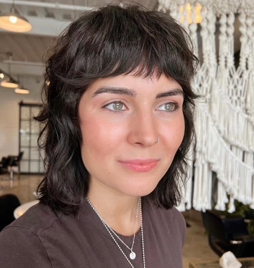 Wavy Dark Brunette Shag With Baby Bangs