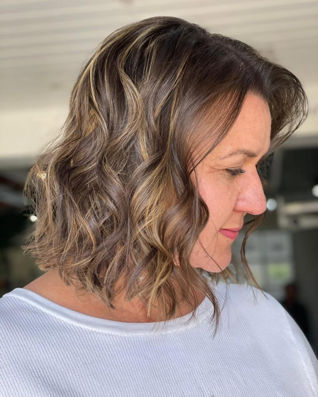 Wavy Honey Blonde Highlights On Shoulder-Length Lob