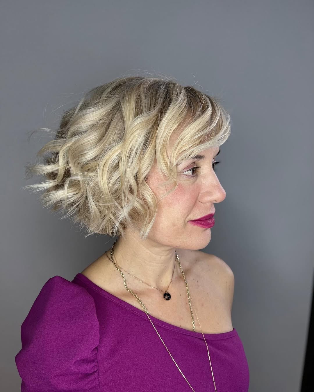 Wavy Platinum Blonde Textured Bob With Side Bangs