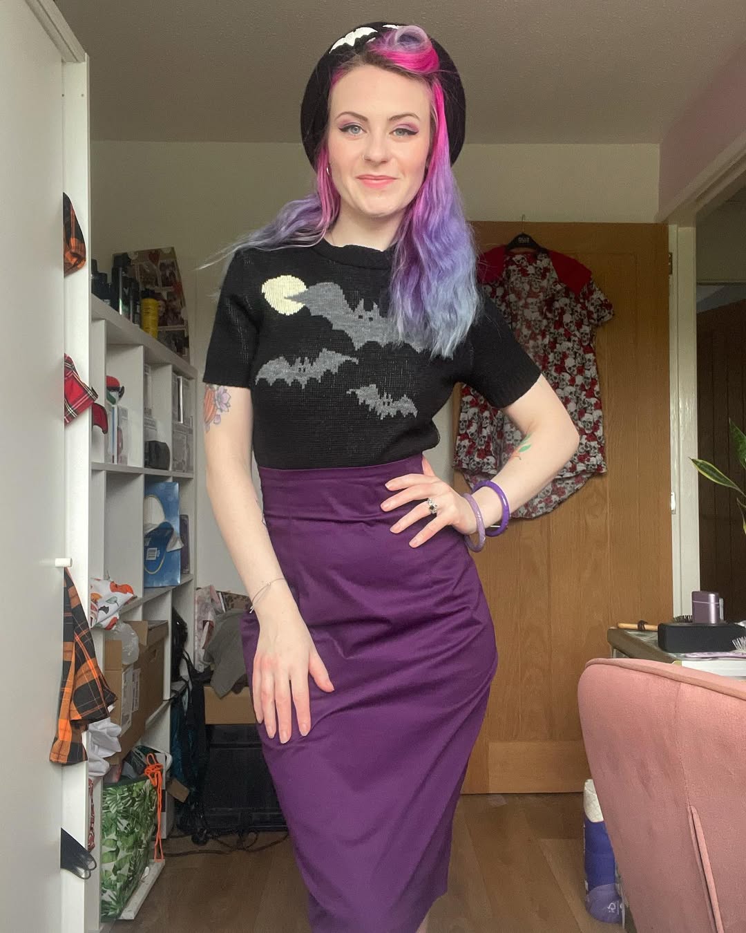 Whimsical Bat Knit With Purple Pencil Skirt