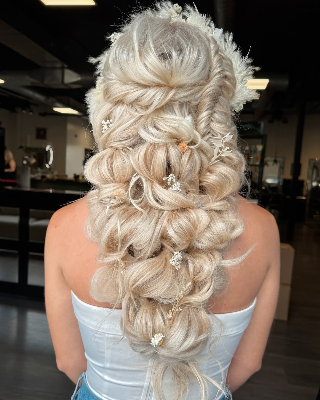 Whimsical Boho Braids With Delicate Floral Accents