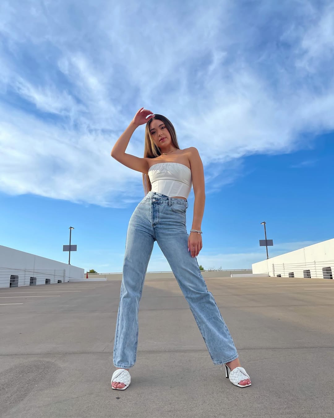White Corset Top & Light Wash Jeans Street Style