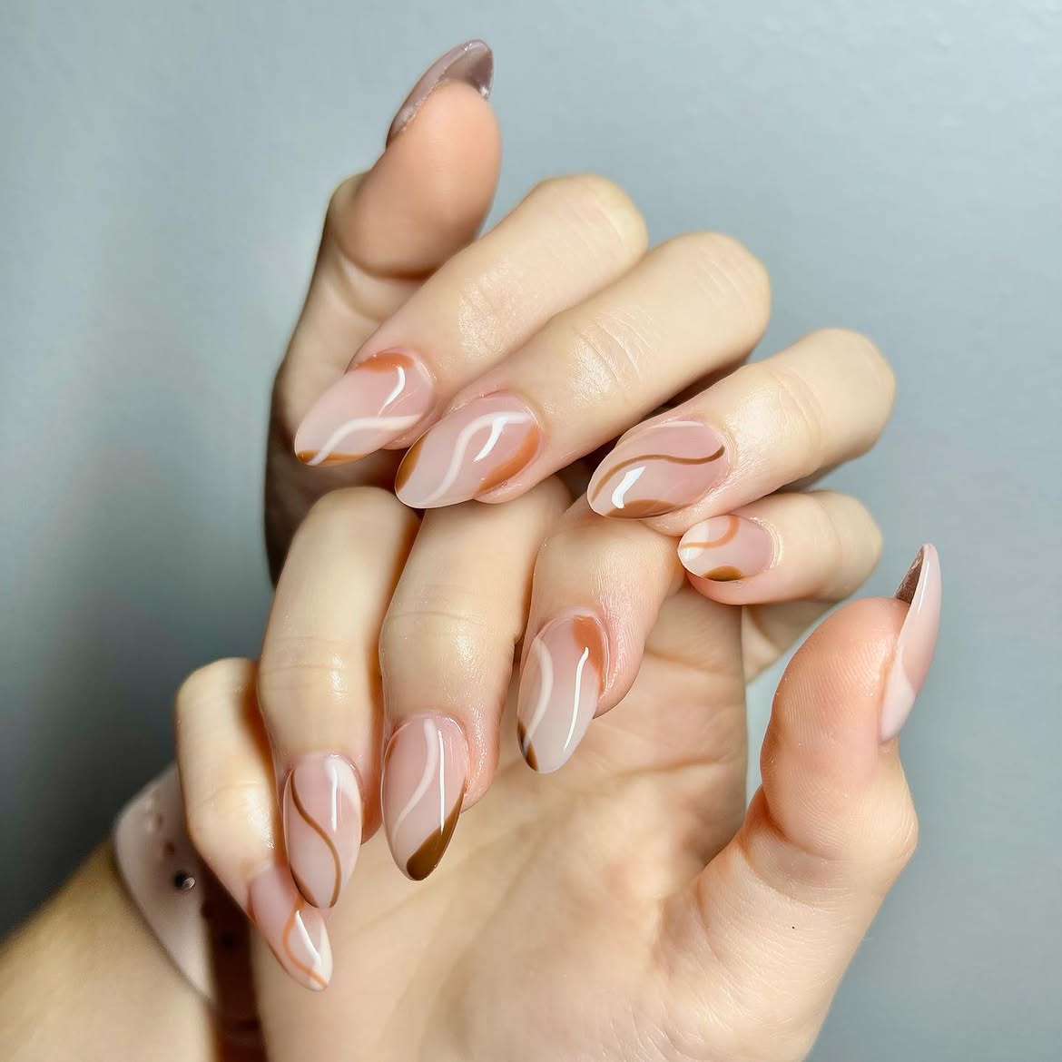 Abstract Swirl Almond Nails in Brown and Cream